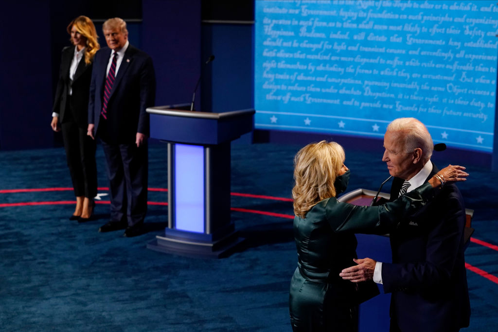 CLEVELAND, OHIO - SEPTEMBER 29:  First lady Melania Trump stands with President Donald Trump as he looks at Democratic presidential candidate former Vice President Joe Biden as he is hugged by his wife Jill Biden during the first presidential debate at the Health Education Campus of Case Western Reserve University on September 29, 2020 in Cleveland, Ohio. This is the first of three planned debates between the two candidates in the lead up to the election on November 3.  (Photo by Morry Gash-Pool/Getty Images)